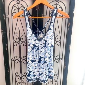 Hollister floral tank top with tied back and blue trim.